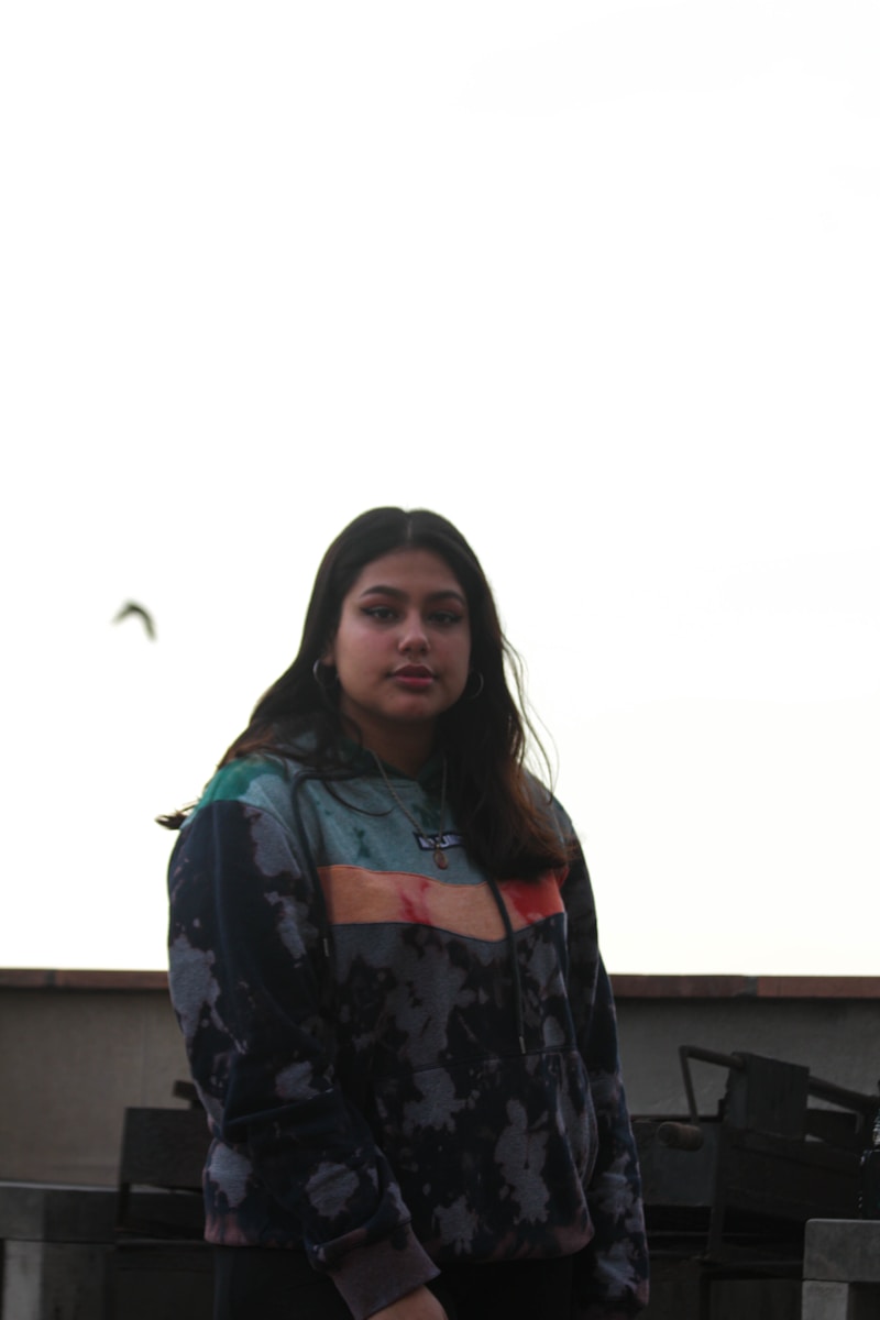 woman in black and gray floral long sleeve shirt